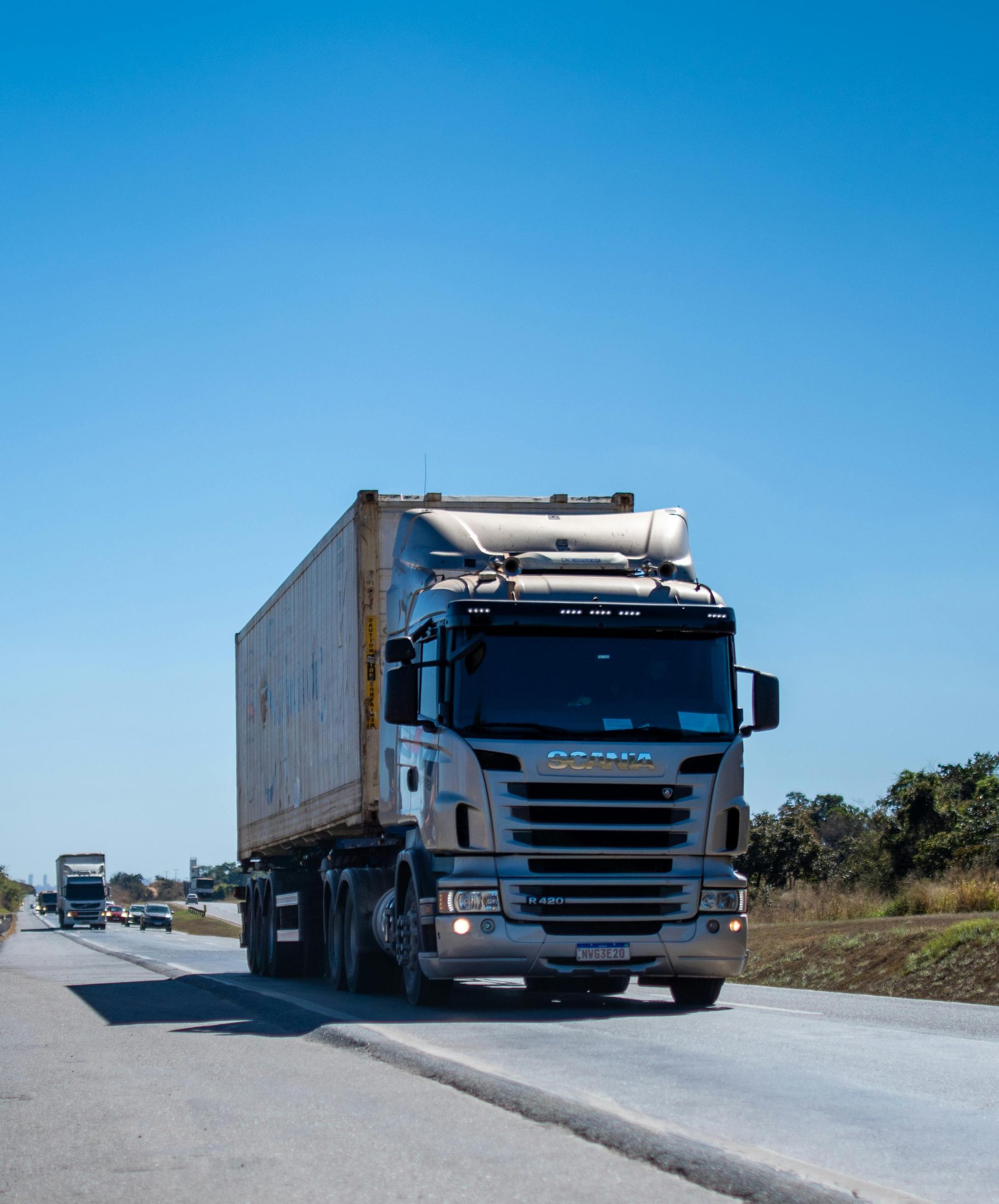 Long-haul tractor and container trailer on the open road